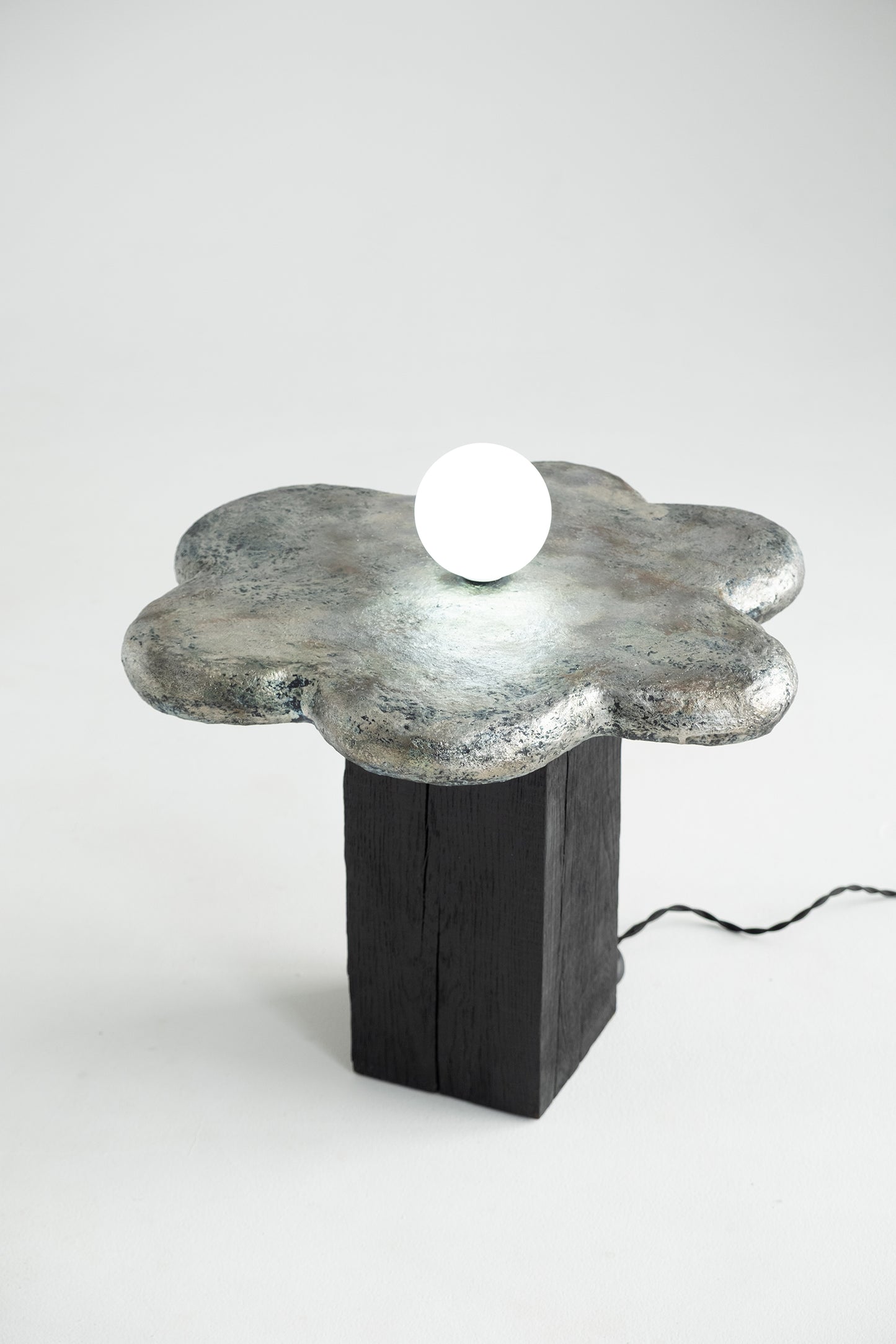 Kvit — Sculptural Coffee Table with Integrated Light